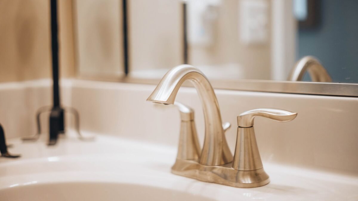 Close-up of a sleek modern bathroom faucet reflecting elegance and luxury, illustrating best limescale remover for faucets