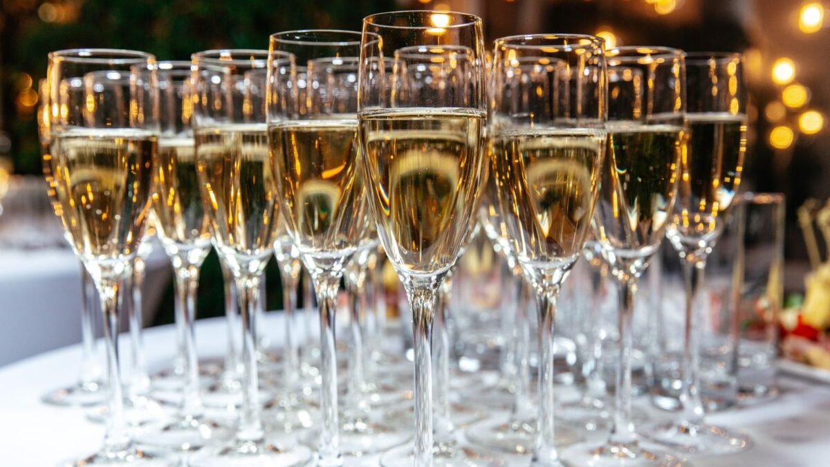 A festive arrangement of sparkling wine glasses on a table, perfect for celebrations and events, illustrating best rinse aid for hard water
