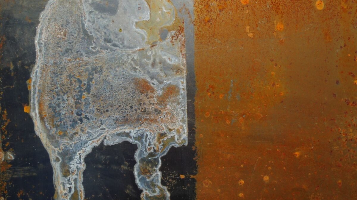 Detailed close-up of a rusty metal sheet with unique erosion patterns and rust stains, perfect , illustrating best rust stain remover