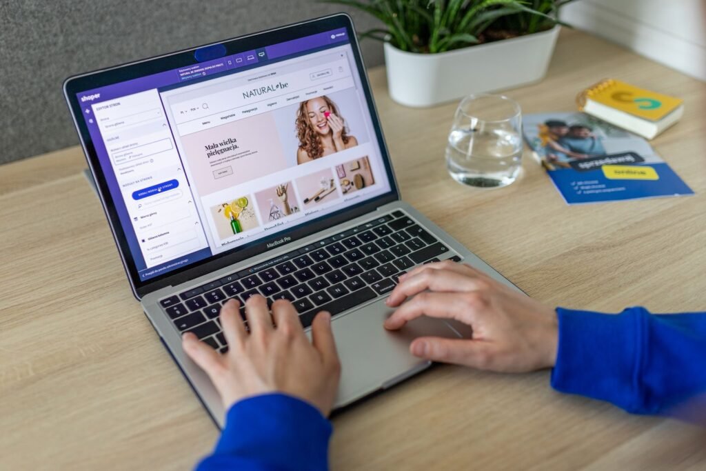 Person checking product details on a laptop before buying a certified shower filter