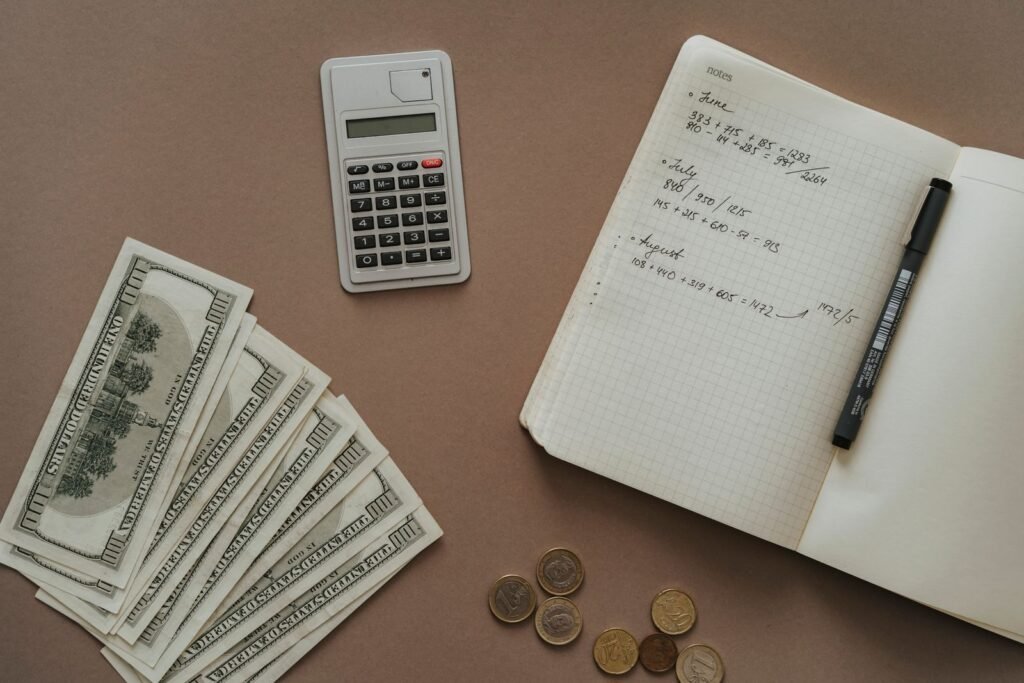 Calculator and notebook for working out the yearly cartridge cost of a shower filter