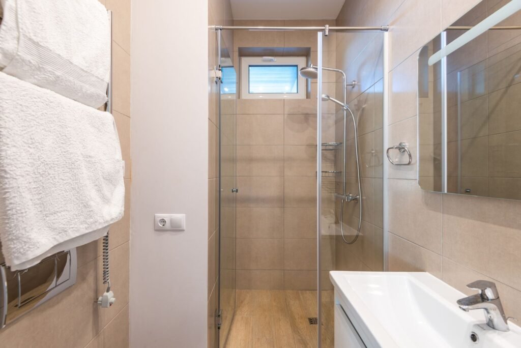 Glass shower enclosure where hard water leaves spots that a shower filter cannot stop