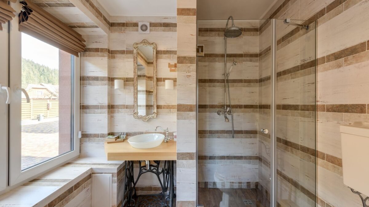 A stylish bathroom featuring a rustic vanity and a glass shower with natural light, illustrating best shower filter for well water