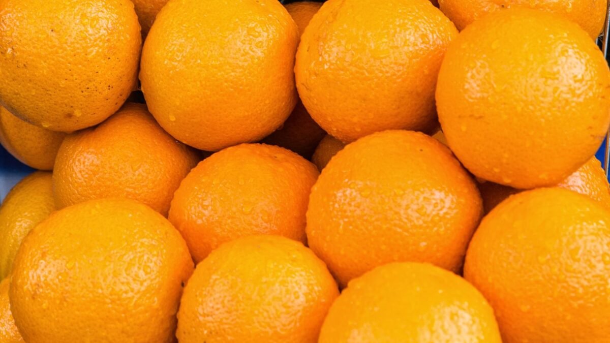 A vibrant close-up of fresh oranges showcasing their natural texture and color, illustrating best vitamin c shower filter