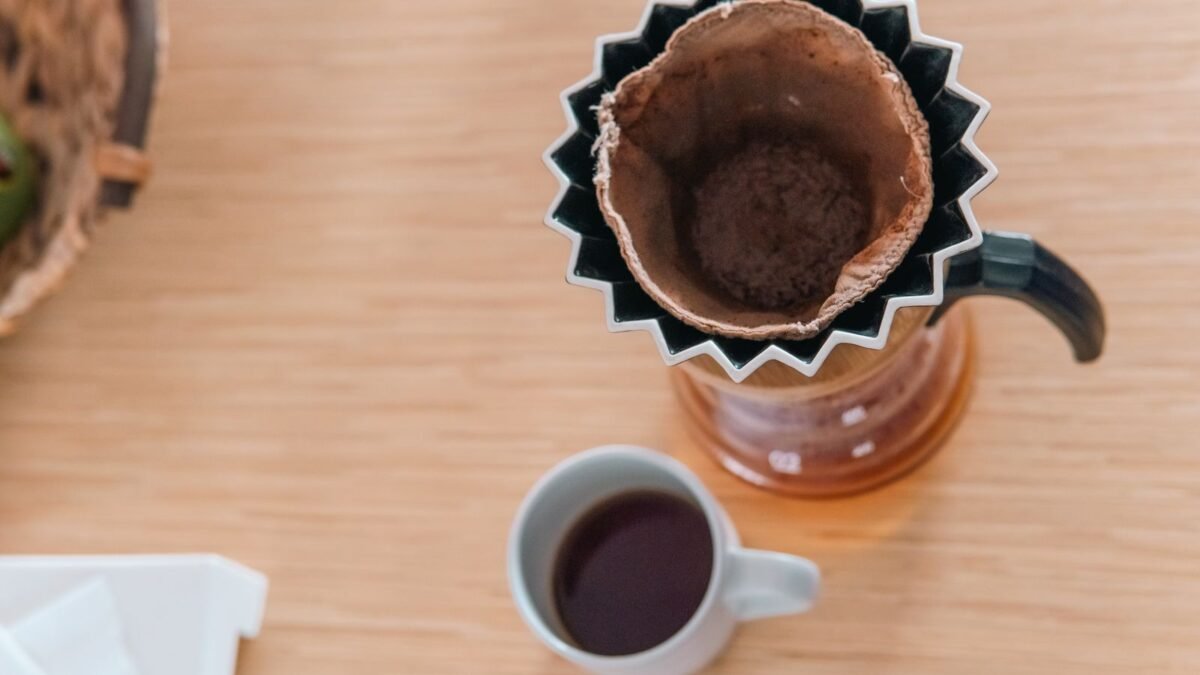 Overhead view of a coffee cup and cloth filter, showcasing hario pour-over method, illustrating best water filter for coffee maker