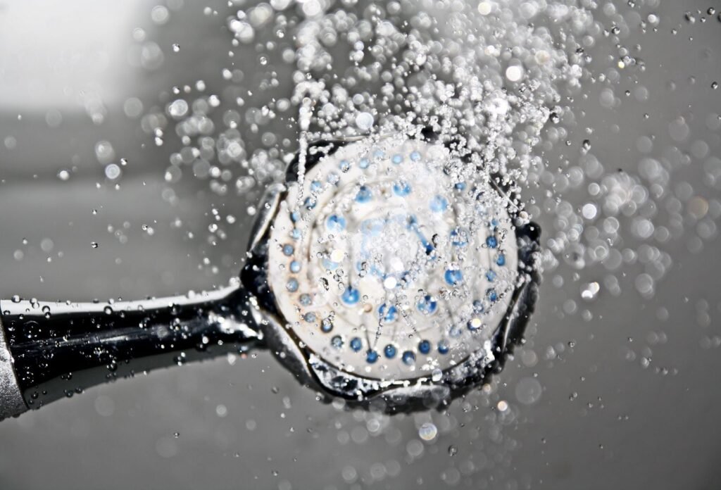 Running shower head during the morning rush when a family softener needs high flow