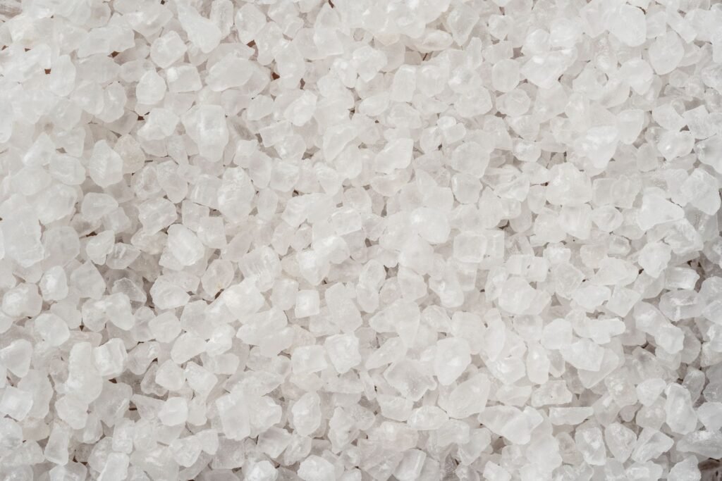White salt crystals like the pellets a family adds to a water softener brine tank each month