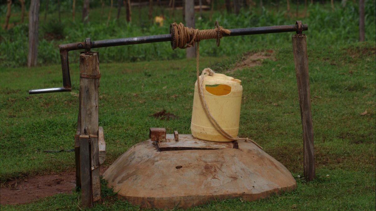 Rustic well with a yellow container in rural Kitale, Kenya, illustrating best well water test kit